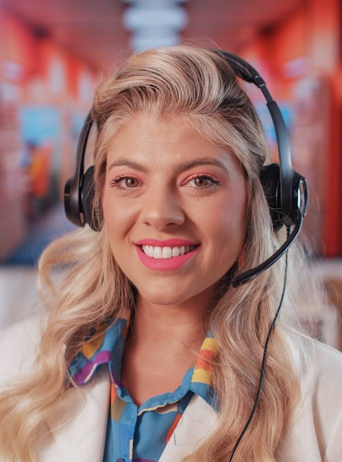 A member of the ParadiseTeam on the support line, headset on, ready to help