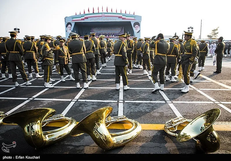 Rows of Iranian soldiers marching in formation during a military parade in Tehran.