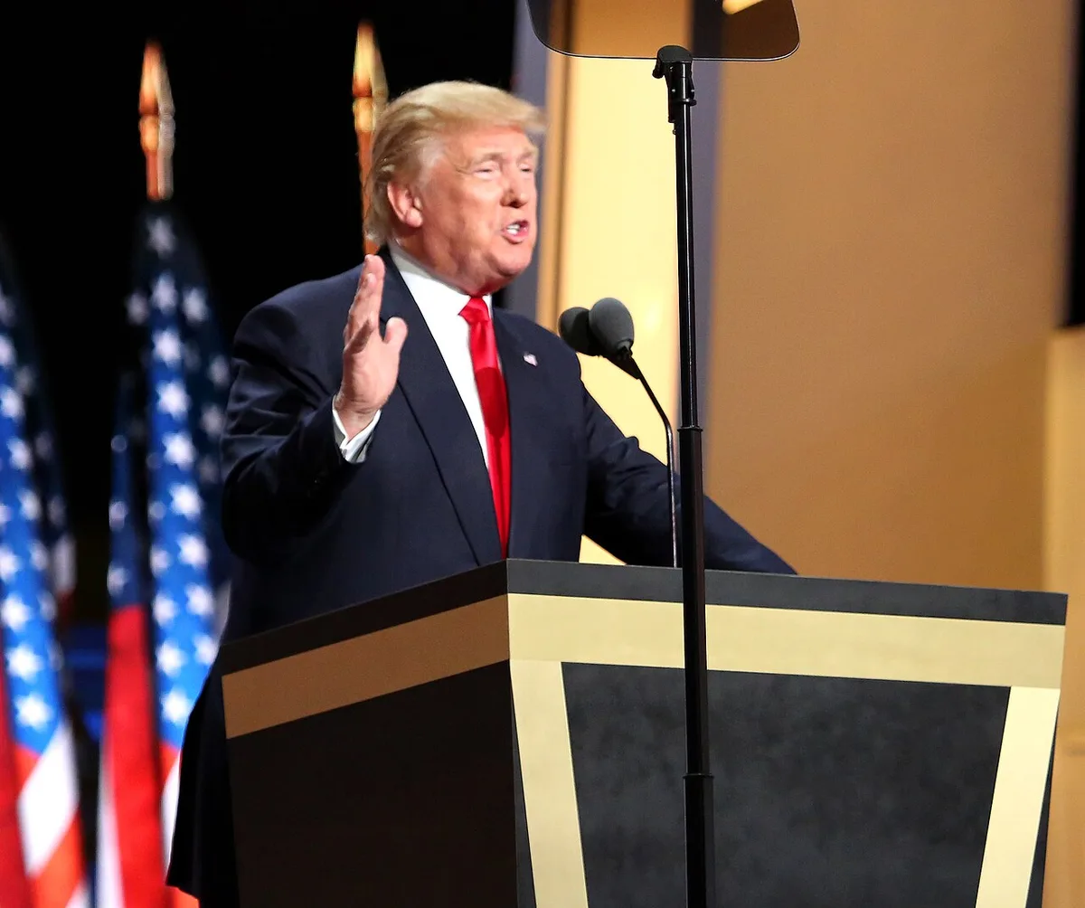 Donald Trump speaking at a podium during the 2016 Republican National Convention.