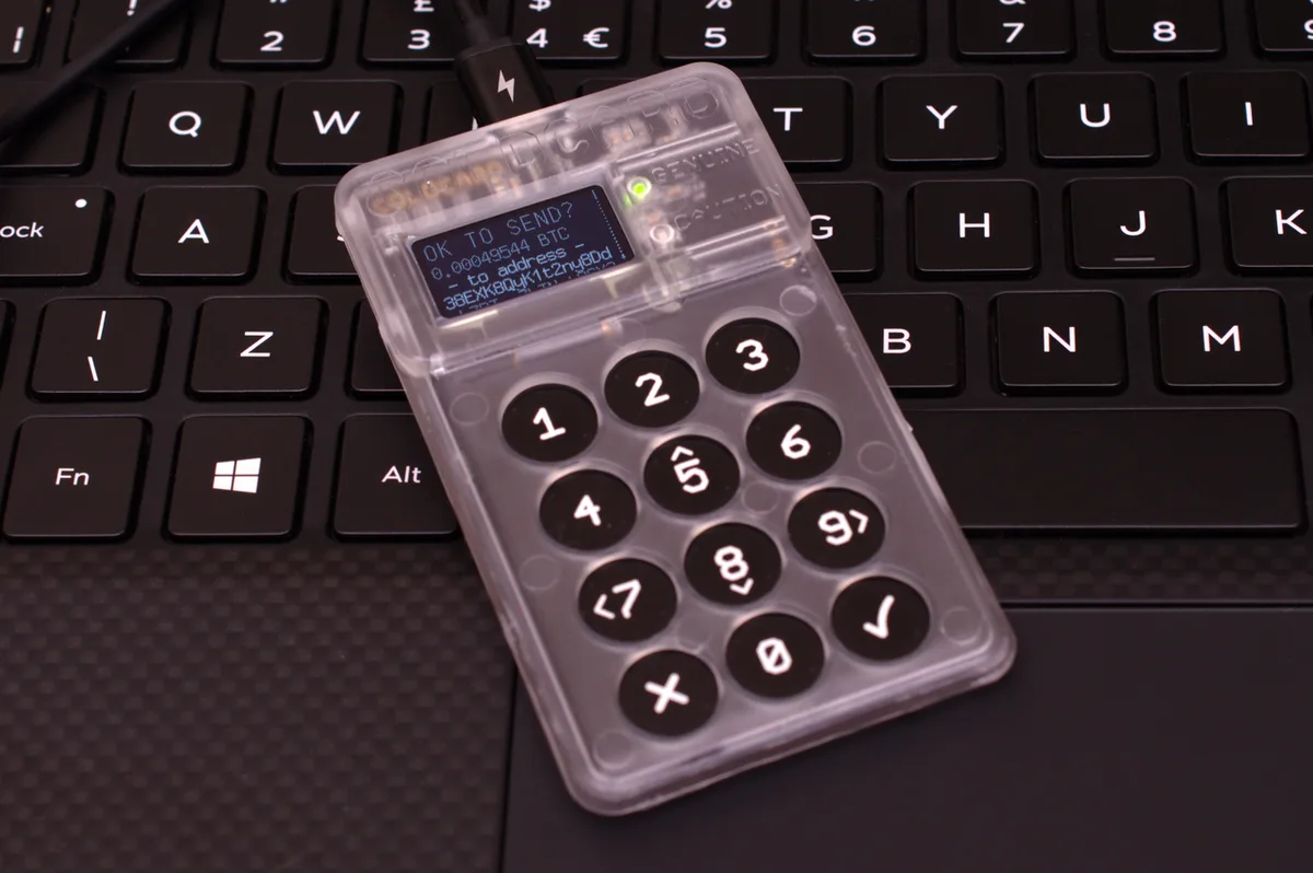 A Coldcard hardware wallet device on a plain background.